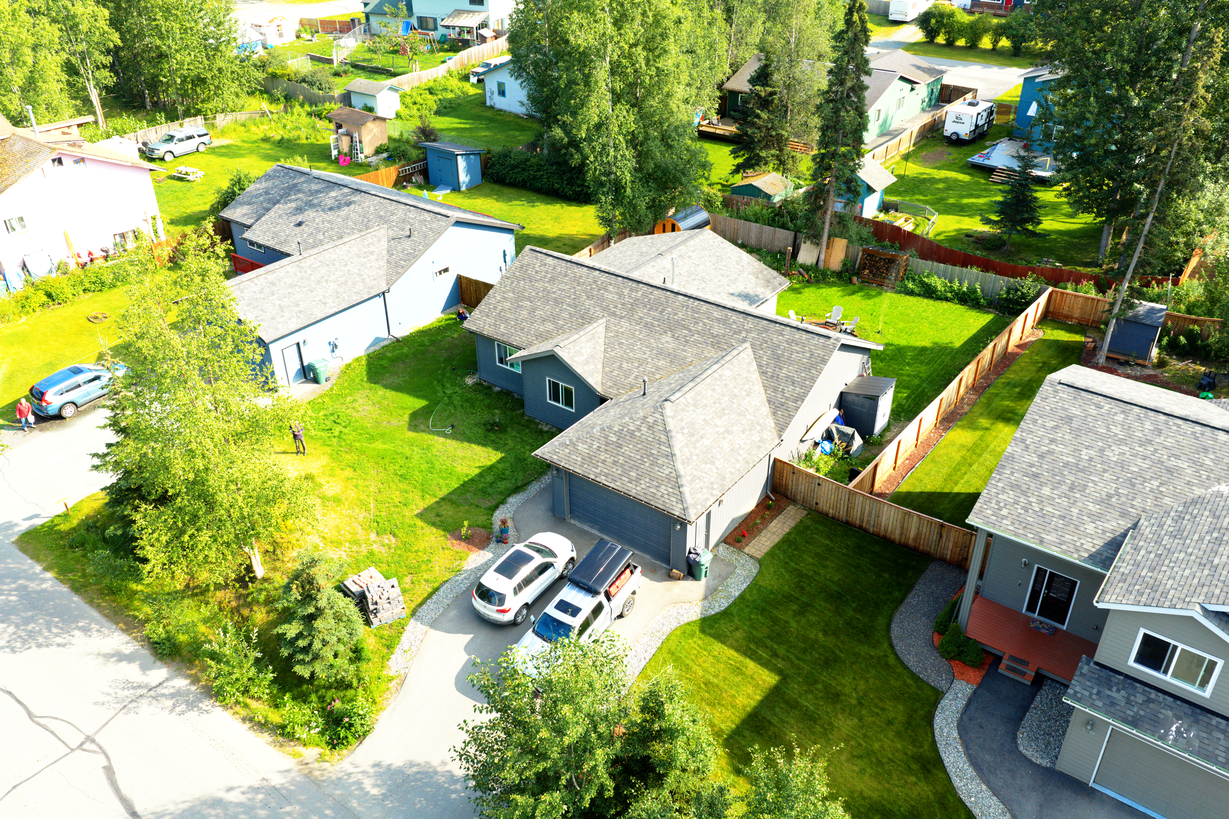 High aerial drone photo of the opposite corner approach of an Alaska home